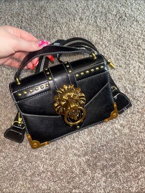 Black Leather Top-Handle Bag with Gold Lion Accent